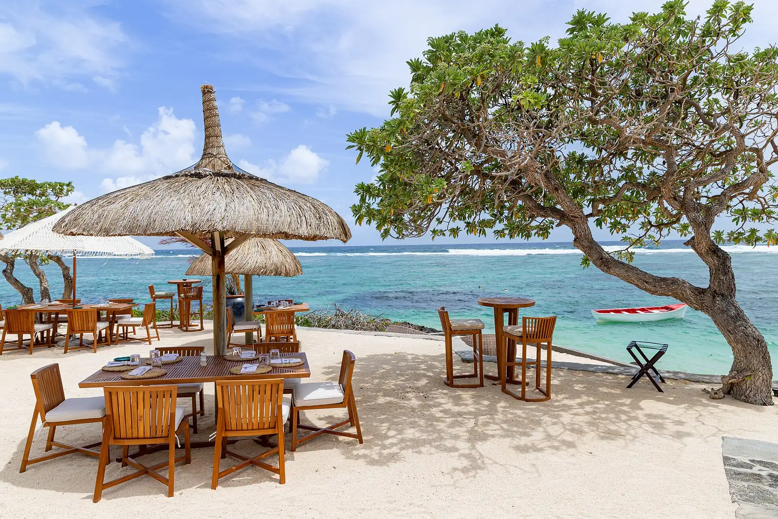 Beachside dining terrace overlooking the lagoon